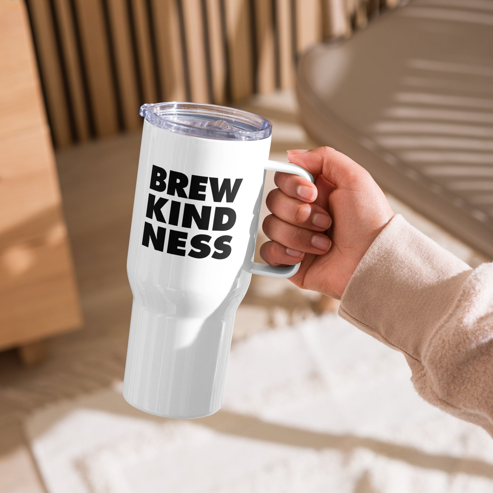Elevated travel mug with "Brew Kindness" text design